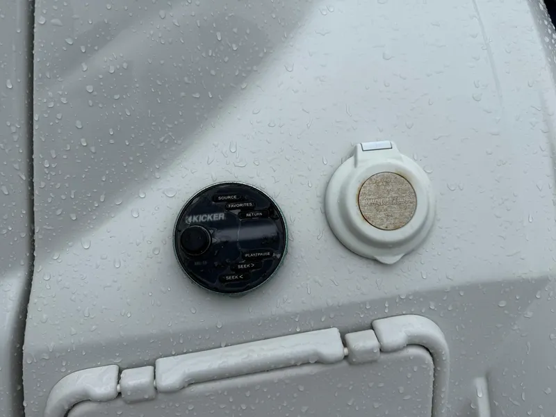 Slide: The Image of Control panel on 2019 Crownline 350 SY boat, featuring Kicker audio system. - 46