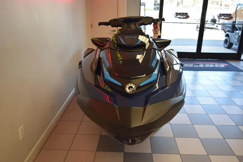 Slide: The Image of 2024 Sea-Doo GTX 300 jet ski displayed indoors on tiled floor. - 3