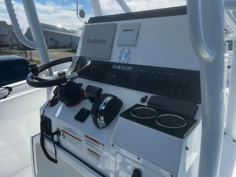 Slide: The Image of 2022 Blackfin 222 CC boat console with Garmin navigation and dual cup holders. - 10