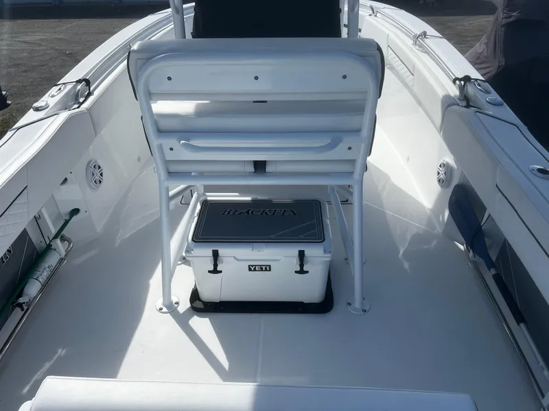 Slide: The Image of 2022 Blackfin 222 CC boat interior with Yeti cooler under seat. - 12