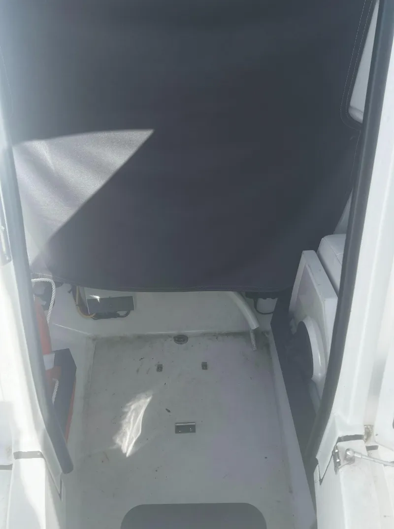 Slide: The Image of 2022 Blackfin 222 CC interior view, featuring a clean, compact cabin space. - 35