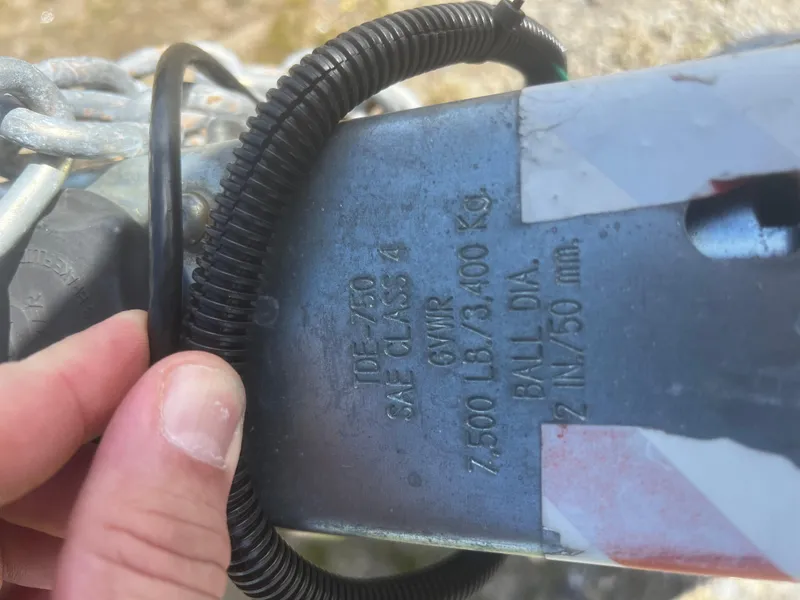 Slide: The Image of Trailer hitch with specifications, including 7,500 lbs capacity, on a 2022 Blackfin 222 CC. - 45