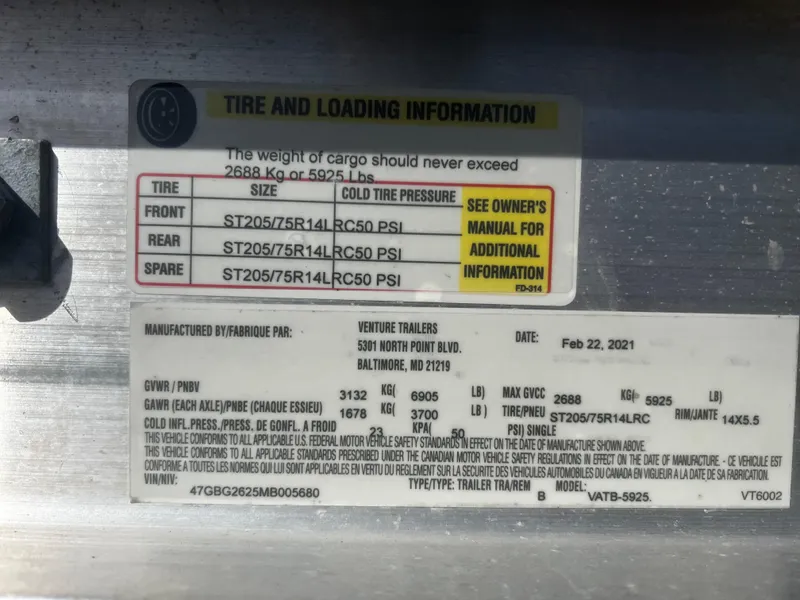 Slide: The Image of Tire and loading information label on a 2022 Blackfin 222 CC boat trailer. - 46