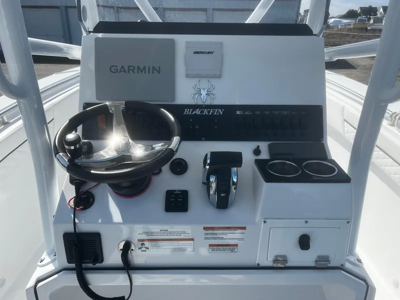 Slide: The Image of 2022 Blackfin 222 CC boat console with Garmin and Mercury controls. - 9