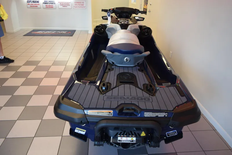 Slide: The Image of 2024 Sea-Doo GTX Limited 300 jet ski displayed indoors on checkered floor. - 5