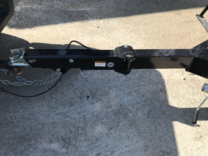 Slide: The Image of Trailer hitch of 2023 Avalon LSZ Elite Windshield on concrete surface. - 16