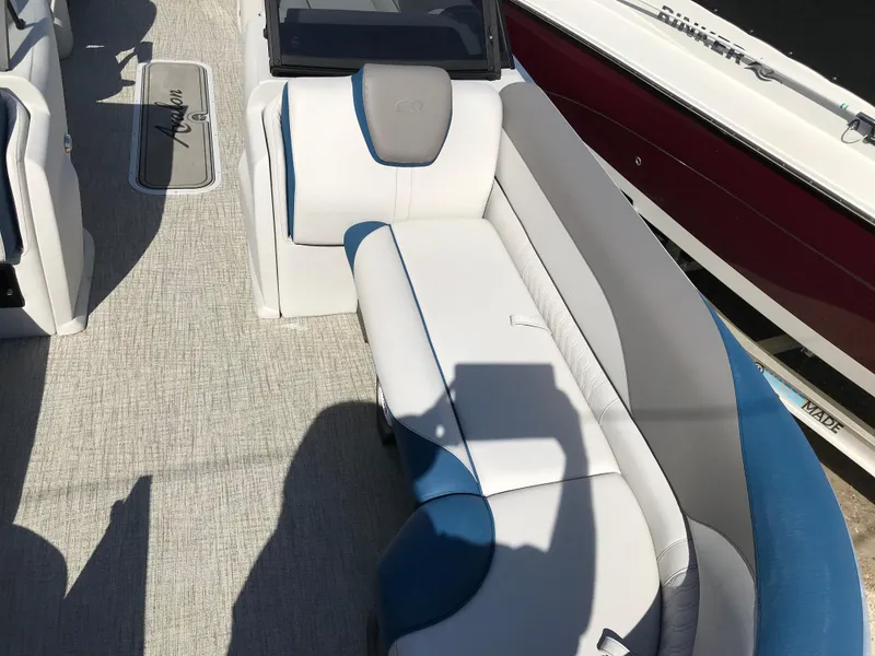 Slide: The Image of 2023 Avalon LSZ Elite Windshield boat interior with white and blue seating. - 26