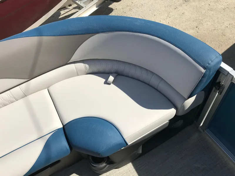 Slide: The Image of 2023 Avalon LSZ Elite Windshield boat seat with blue and white upholstery. - 28