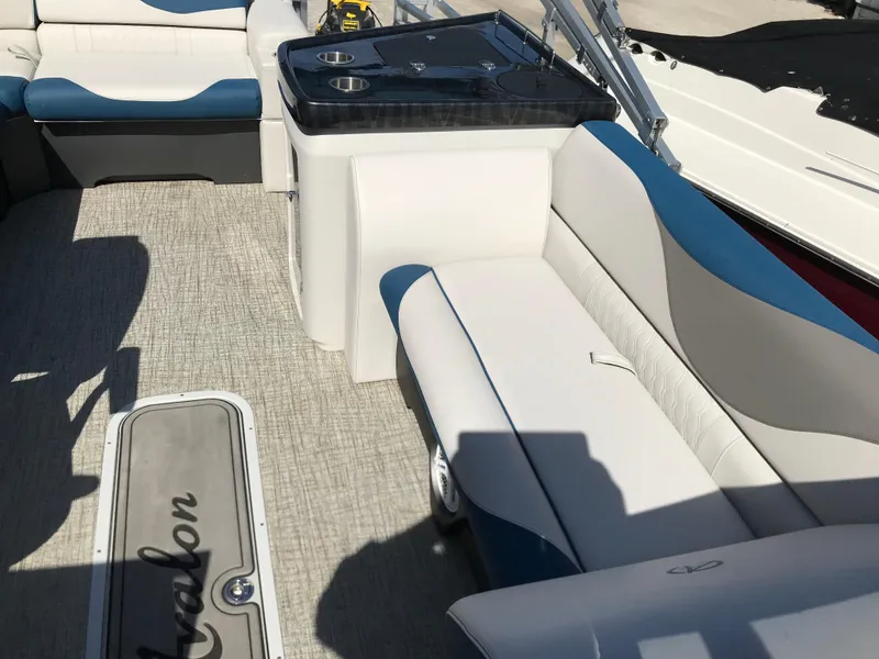 Slide: The Image of 2023 Avalon LSZ Elite Windshield boat interior with seating and table. - 34