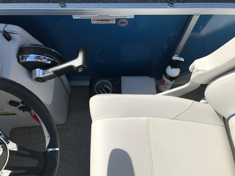 Slide: The Image of 2023 Avalon LSZ Elite Windshield boat interior with steering wheel and seating. - 36