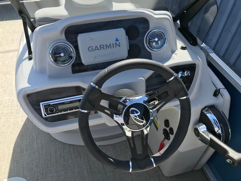 Slide: The Image of 2023 Avalon LSZ Elite Windshield boat dashboard with Garmin navigation and steering wheel. - 38