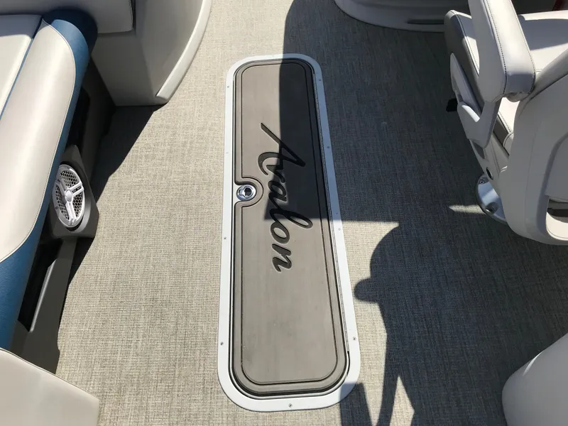 Slide: The Image of 2023 Avalon LSZ Elite Windshield boat interior with branded floor compartment. - 41