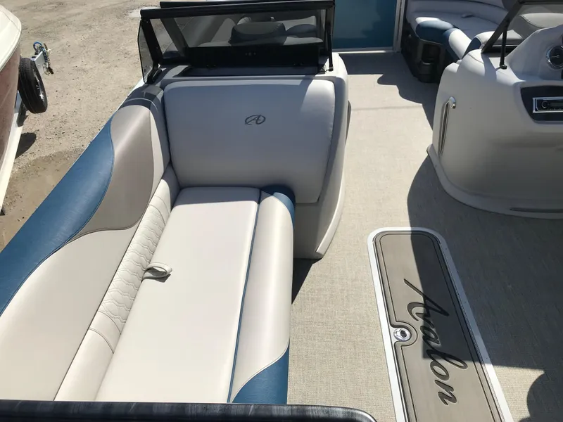 Slide: The Image of 2023 Avalon LSZ Elite Windshield boat interior with plush seating and stylish design. - 43