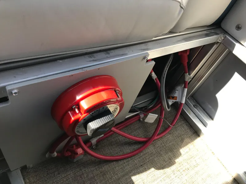 Slide: The Image of 2023 Avalon LSZ Elite Windshield boat interior with red wiring and components. - 45