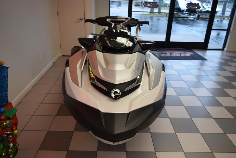 Slide: The Image of 2024 Sea-Doo GTX Limited 300 jet ski displayed indoors on checkered floor. - 3
