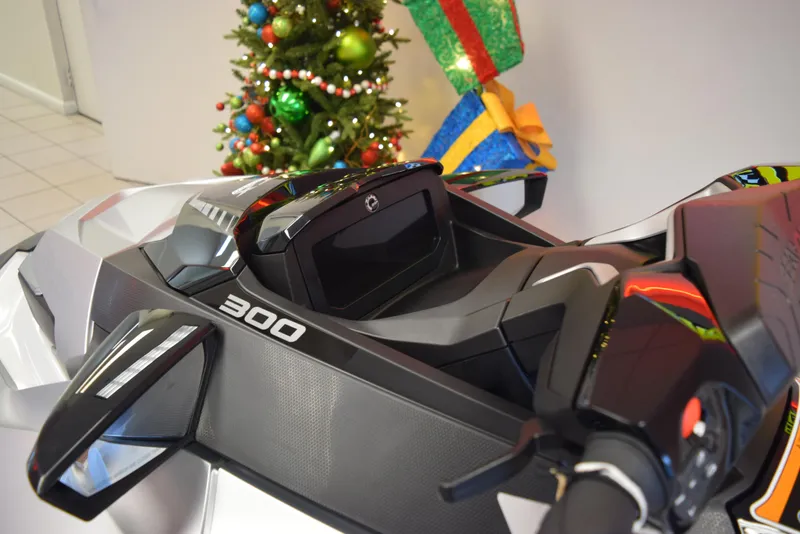 Slide: The Image of 2024 Sea-Doo GTX Limited 300 dashboard with holiday decorations in the background. - 8