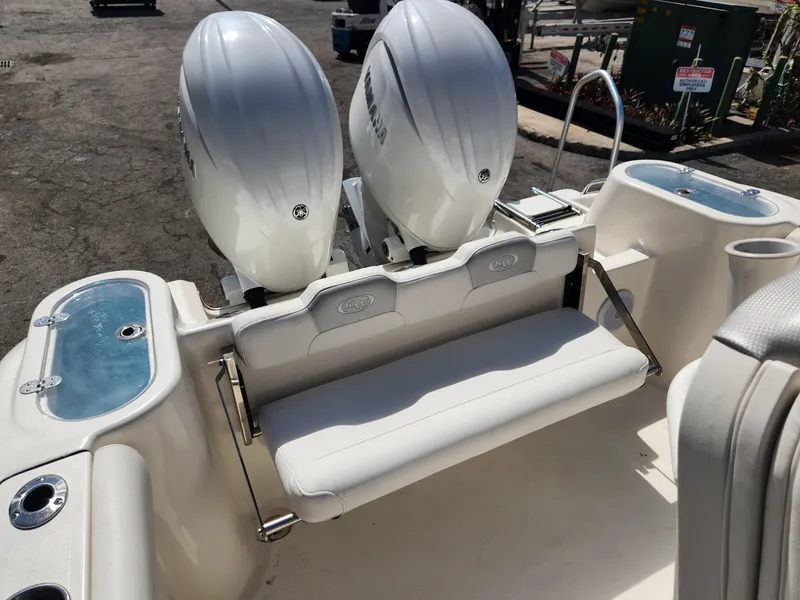 Slide: The Image of 2024 Key West 244 CC boat with dual engines and rear seating. - 10
