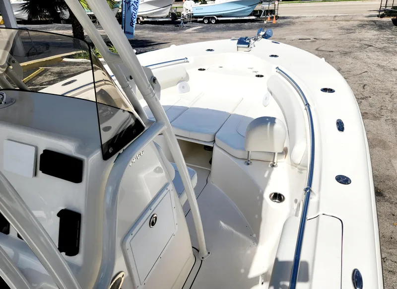 Slide: The Image of 2024 Key West 244 CC boat with spacious deck and seating area. - 12