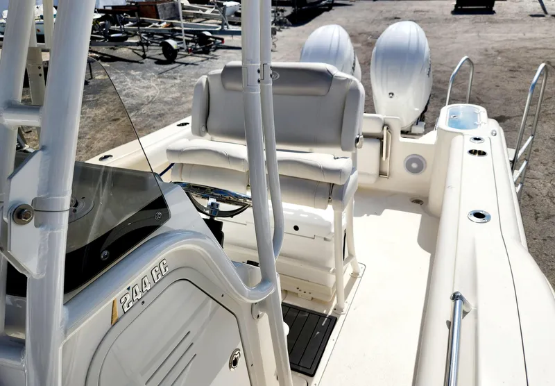 Slide: The Image of 2024 Key West 244 CC boat interior with dual engines and seating. - 8