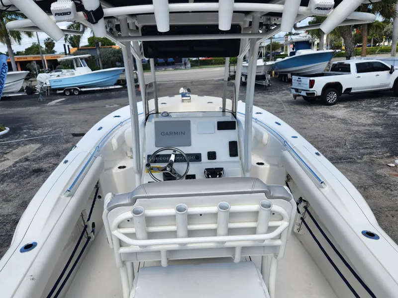 Slide: The Image of 2024 Key West 244 CC boat interior with Garmin navigation system, docked in a marina. - 9