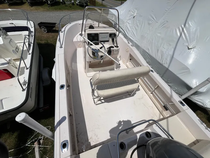 Slide: The Image of 2012 Grady-White Fisherman 180 boat interior with steering console and seating. - 1
