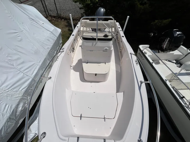 Slide: The Image of 2012 Grady-White Fisherman 180 boat, aerial view, docked between other boats. - 3