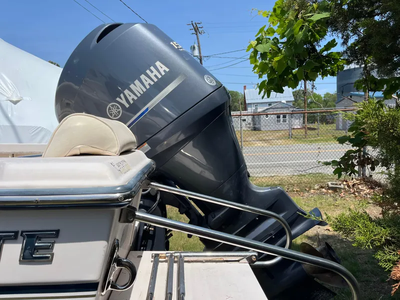 Slide: The Image of 2012 Grady-White Fisherman 180 with Yamaha outboard motor, parked outdoors. - 6