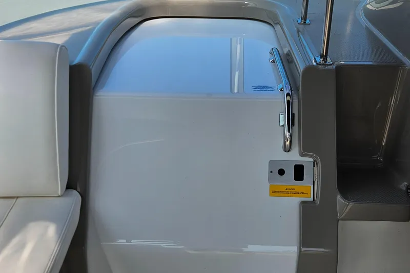 Slide: The Image of 2004 Cruisers Yachts 340 Express interior with sleek seating and modern design. - 27