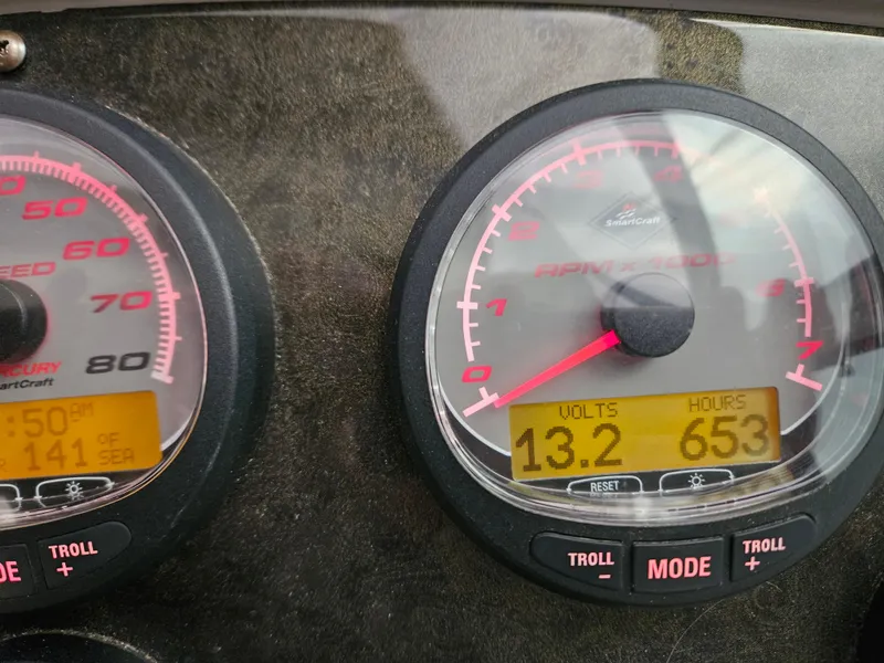 Slide: The Image of Close-up of 2004 Cruisers Yachts 340 Express dashboard gauges displaying volts and engine hours. - 42