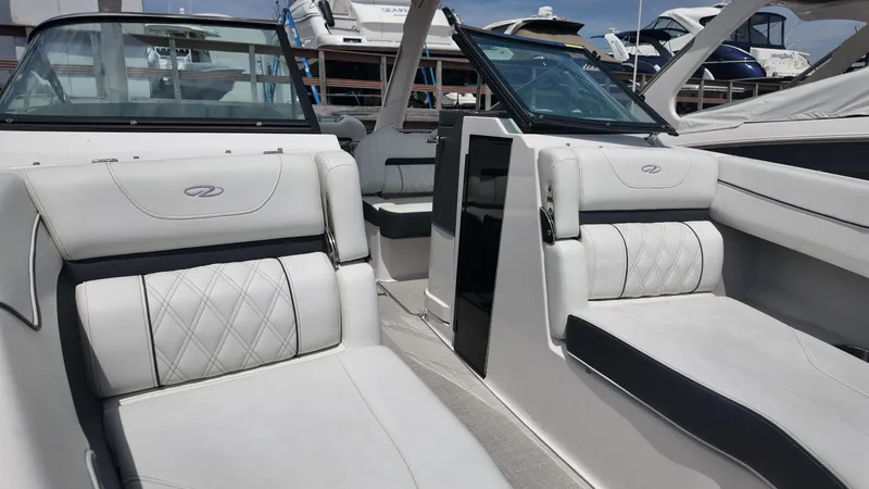 Slide: The Image of 2021 Regal LX6 boat interior with luxurious white seating and modern design. - 18