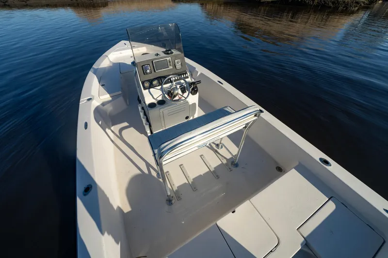 Slide: The Image of 2005 Pathfinder 2000v boat with console and seating on calm water. - 3