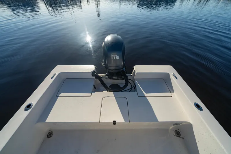 Slide: The Image of 2005 Pathfinder 2000v boat with 115 HP engine on calm water. - 7
