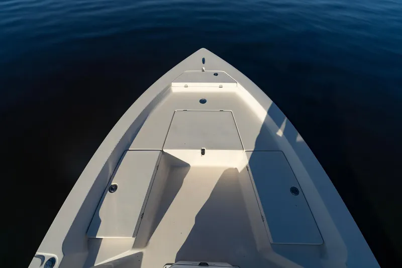 Slide: The Image of Bow of a 2005 Pathfinder 2000v boat on calm water. - 8
