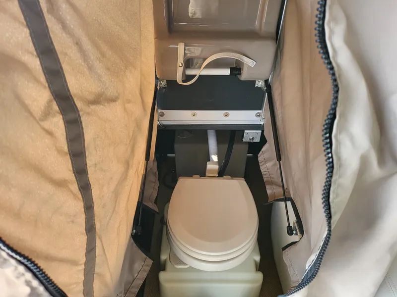 Slide: The Image of 2014 Premier 275 Boundary Waters portable toilet in enclosed space. - 10