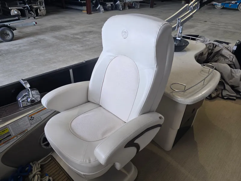 Slide: The Image of White captain's chair on 2014 Premier 275 Boundary Waters boat. - 12