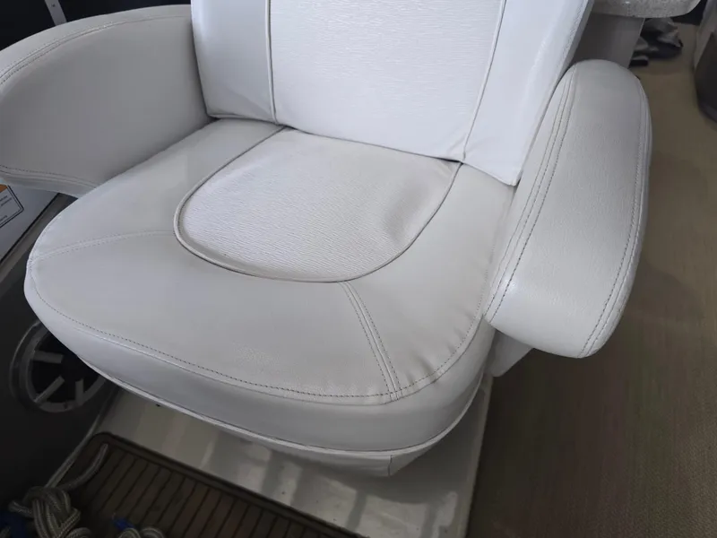 Slide: The Image of White leather seat on 2014 Premier 275 Boundary Waters boat. - 14