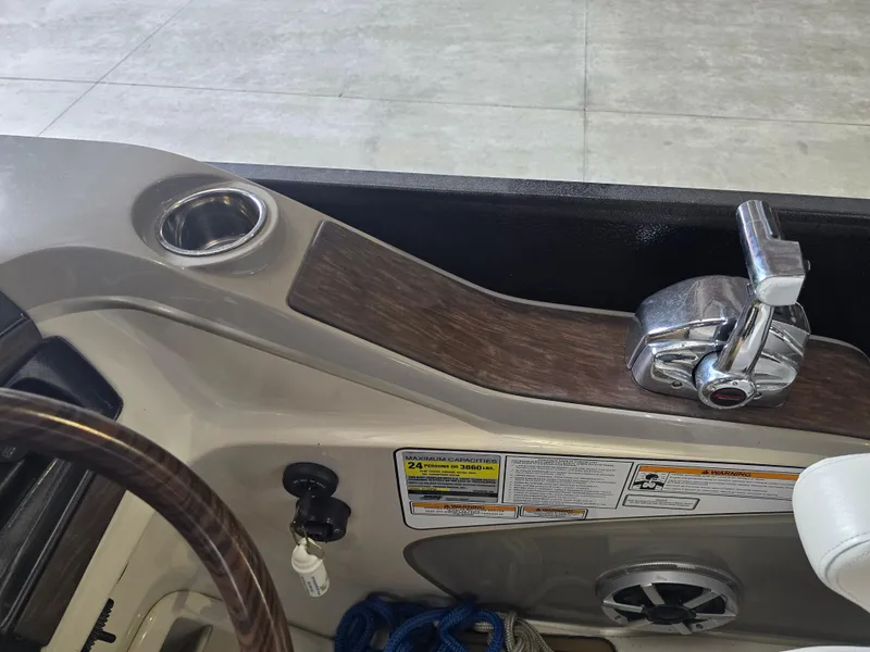 Slide: The Image of Interior view of a 2014 Premier 275 Boundary Waters boat control panel. - 16