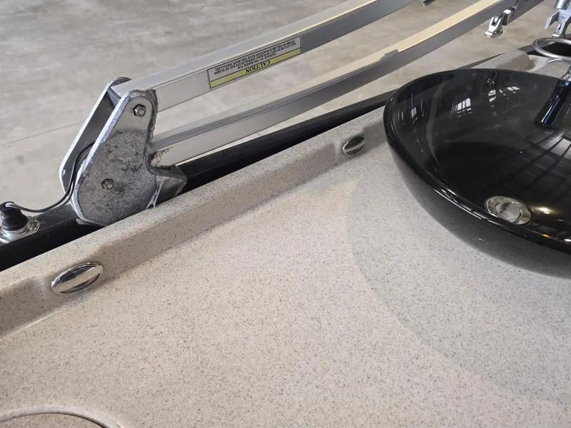 Slide: The Image of 2014 Premier 275 Boundary Waters boat detail with black sink and metal hardware. - 21