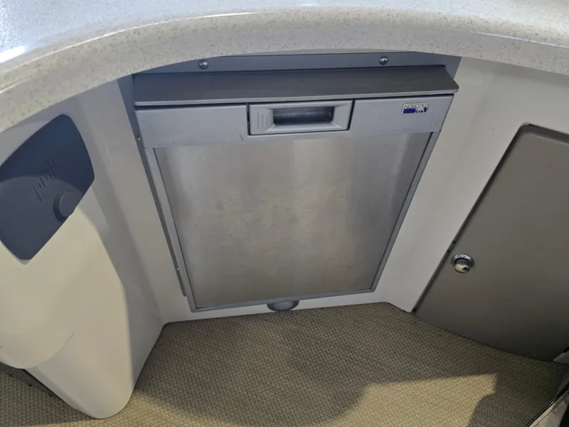 Slide: The Image of Built-in refrigerator in 2014 Premier 275 Boundary Waters boat interior. - 23