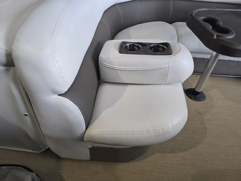 Slide: The Image of Premier 275 Boundary Waters 2014 boat seating with cup holders and table. - 26