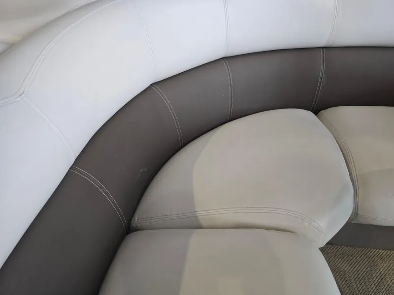 Slide: The Image of 2014 Premier 275 Boundary Waters boat seating, gray and white upholstery. - 27
