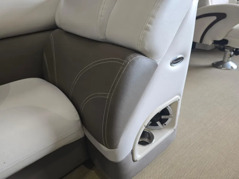 Slide: The Image of Premier 275 Boundary Waters 2014 boat seating with cup holder and speaker. - 30