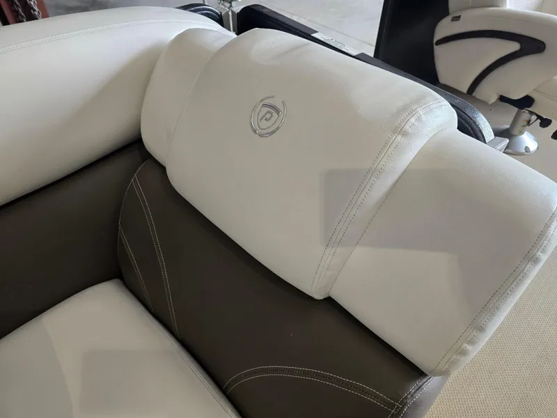 Slide: The Image of Luxurious seating on 2014 Premier 275 Boundary Waters boat, featuring elegant stitching and design. - 32