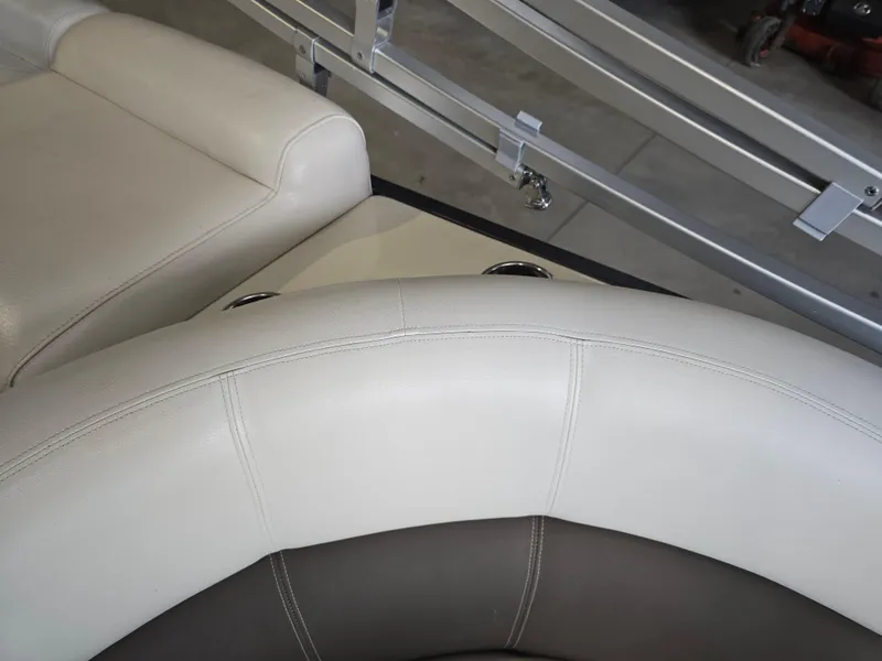 Slide: The Image of Premier 275 Boundary Waters 2014 boat seating with beige and brown upholstery. - 37