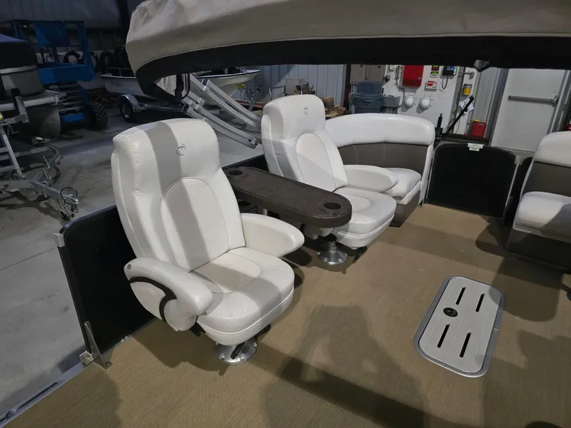 Slide: The Image of 2014 Premier 275 Boundary Waters boat interior with white seating and table. - 42