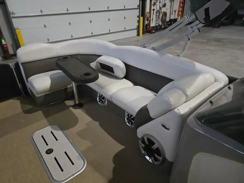 Slide: The Image of 2014 Premier 275 Boundary Waters pontoon boat interior with plush seating and table. - 43