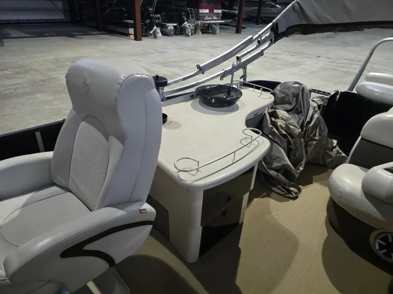 Slide: The Image of 2014 Premier 275 Boundary Waters boat interior with seating and control panel. - 45