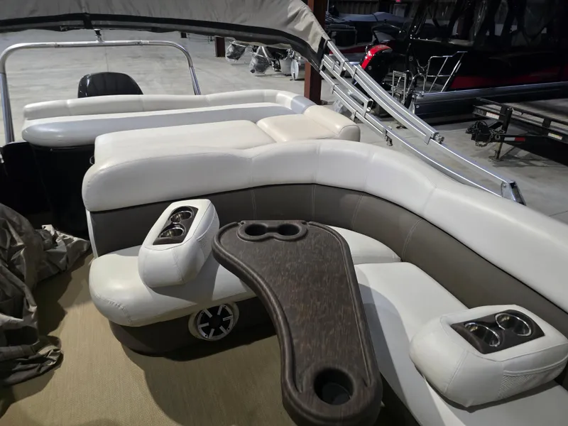 Slide: The Image of 2014 Premier 275 Boundary Waters pontoon boat with luxurious seating and cup holders. - 46