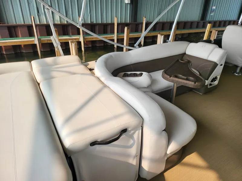 Slide: The Image of 2014 Premier 275 Boundary Waters boat interior with beige seating and table. - 5