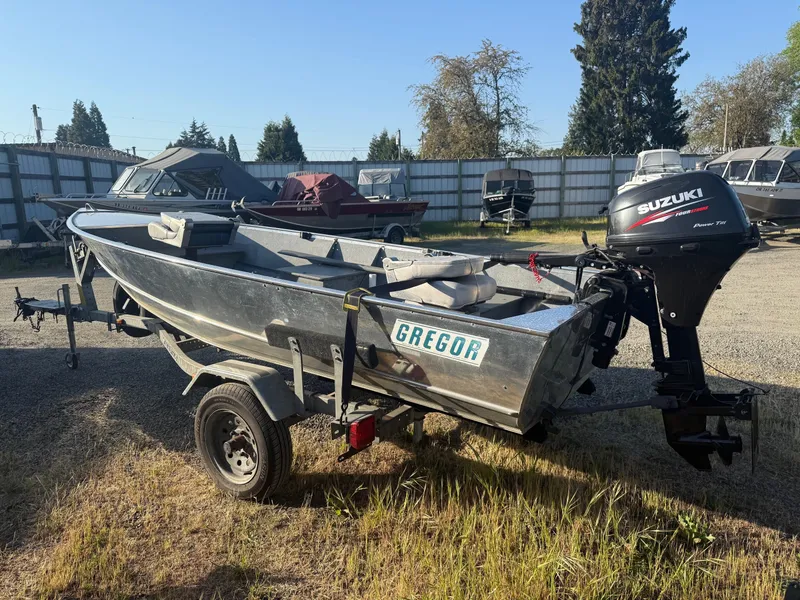 Slide: The Image of 1994 Gregor CH-42L aluminum boat with Suzuki outboard motor on trailer. - 3